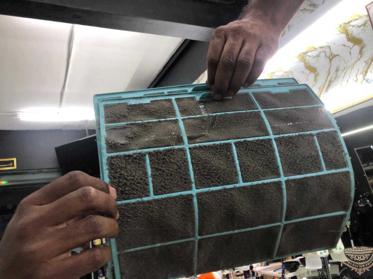 Dirty split aircond filters before RumahPro Malaysia deep-clean service