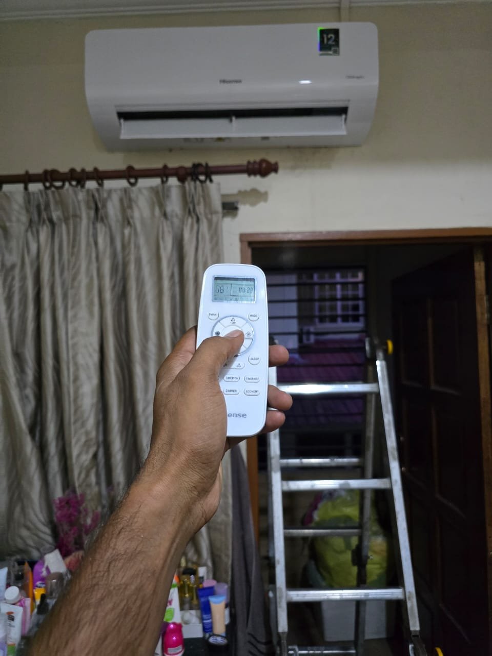 Split aircond handover with remote control to Malaysian homeowner, RumahPro service